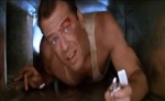 John McClane crawls through an air duct.