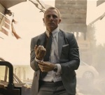 James Bond shrugs off a shoulder injury and proceeds with style.