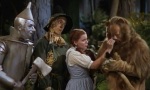 Tin Man, Scarecrow and Dorothy comfort Cowardly Lion in 1939's The Wizard of Oz.