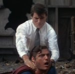 Clark Kent chokes the evil Superman.