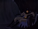 Batman is extremely depressed as he sits in the Batcave.